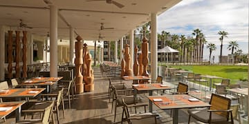 a restaurant with tables and chairs