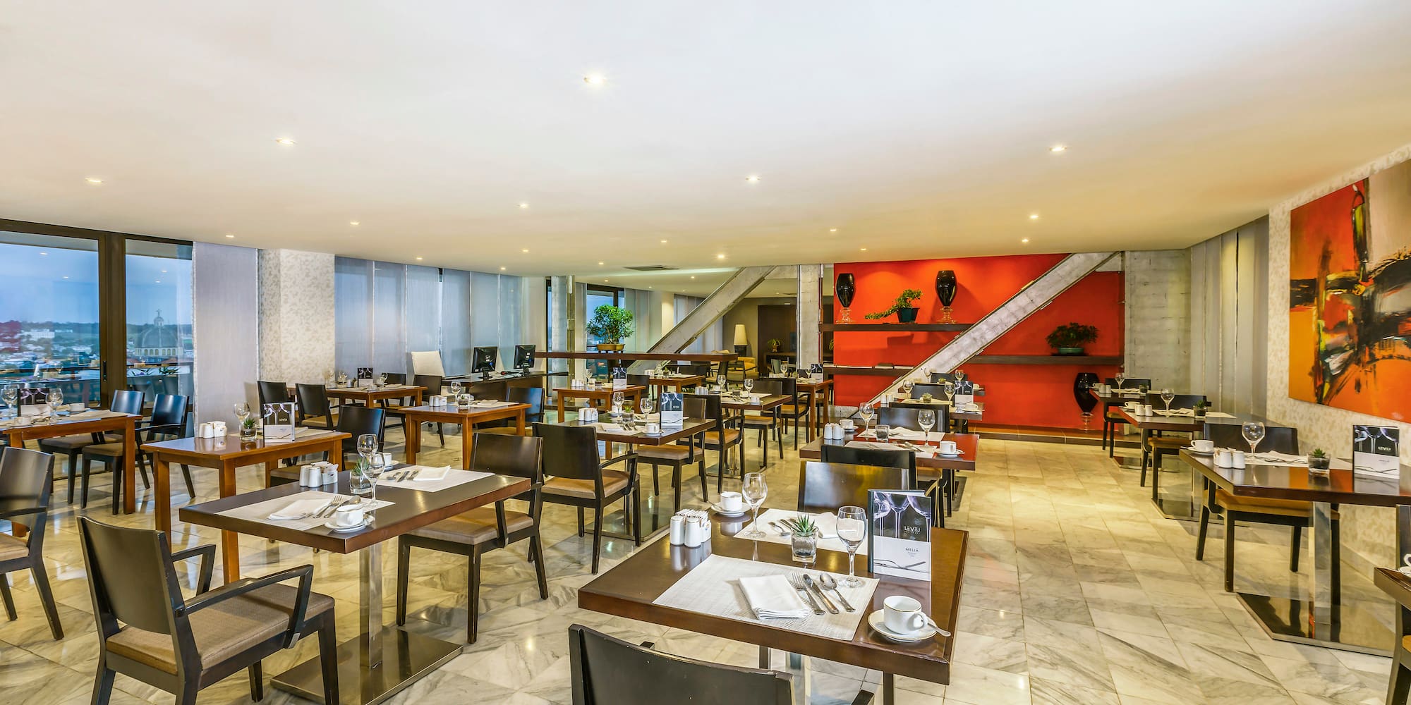 a room with tables and chairs