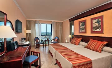 a room with a bed and a desk