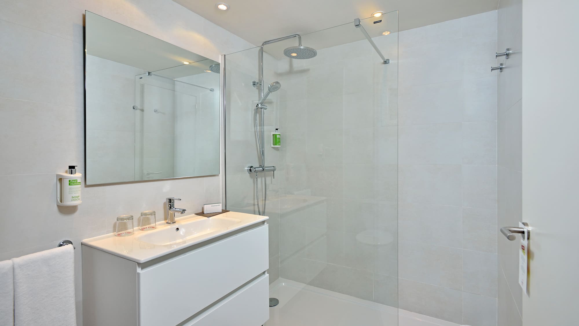 a bathroom with a shower and sink