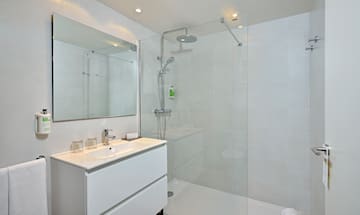 a bathroom with a shower and sink