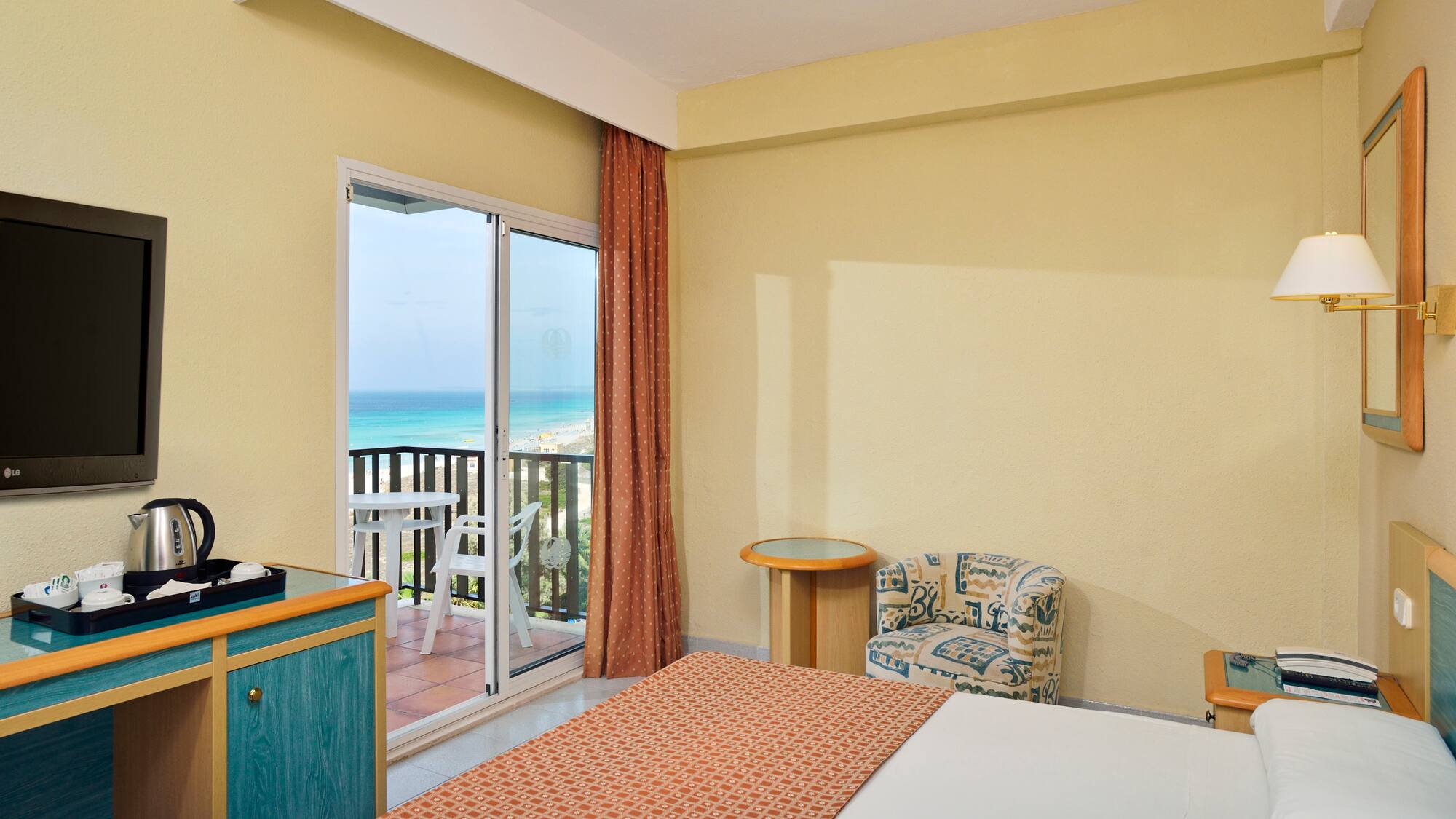 a room with a bed and a glass door