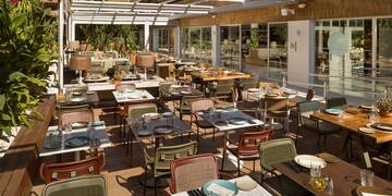a restaurant with tables and chairs