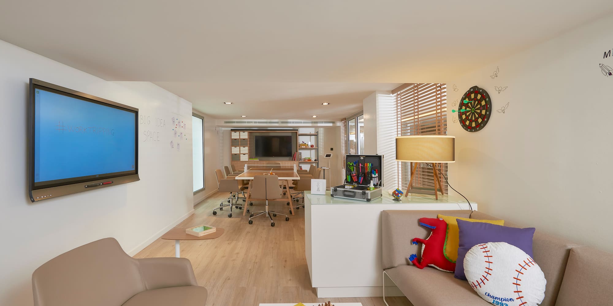 a room with a tv and couches