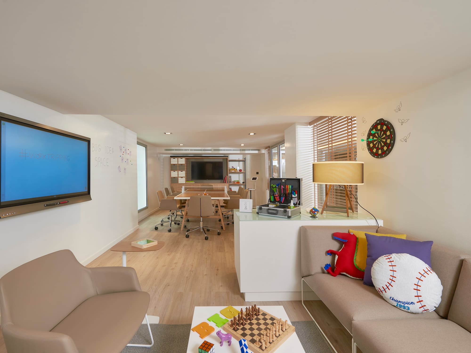 a room with a tv and couches.