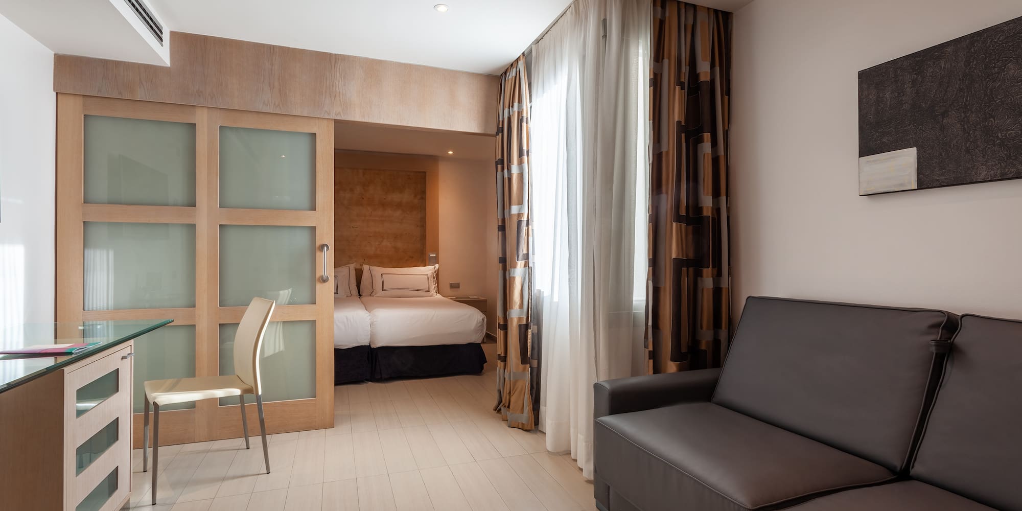 a room with a couch and a bed