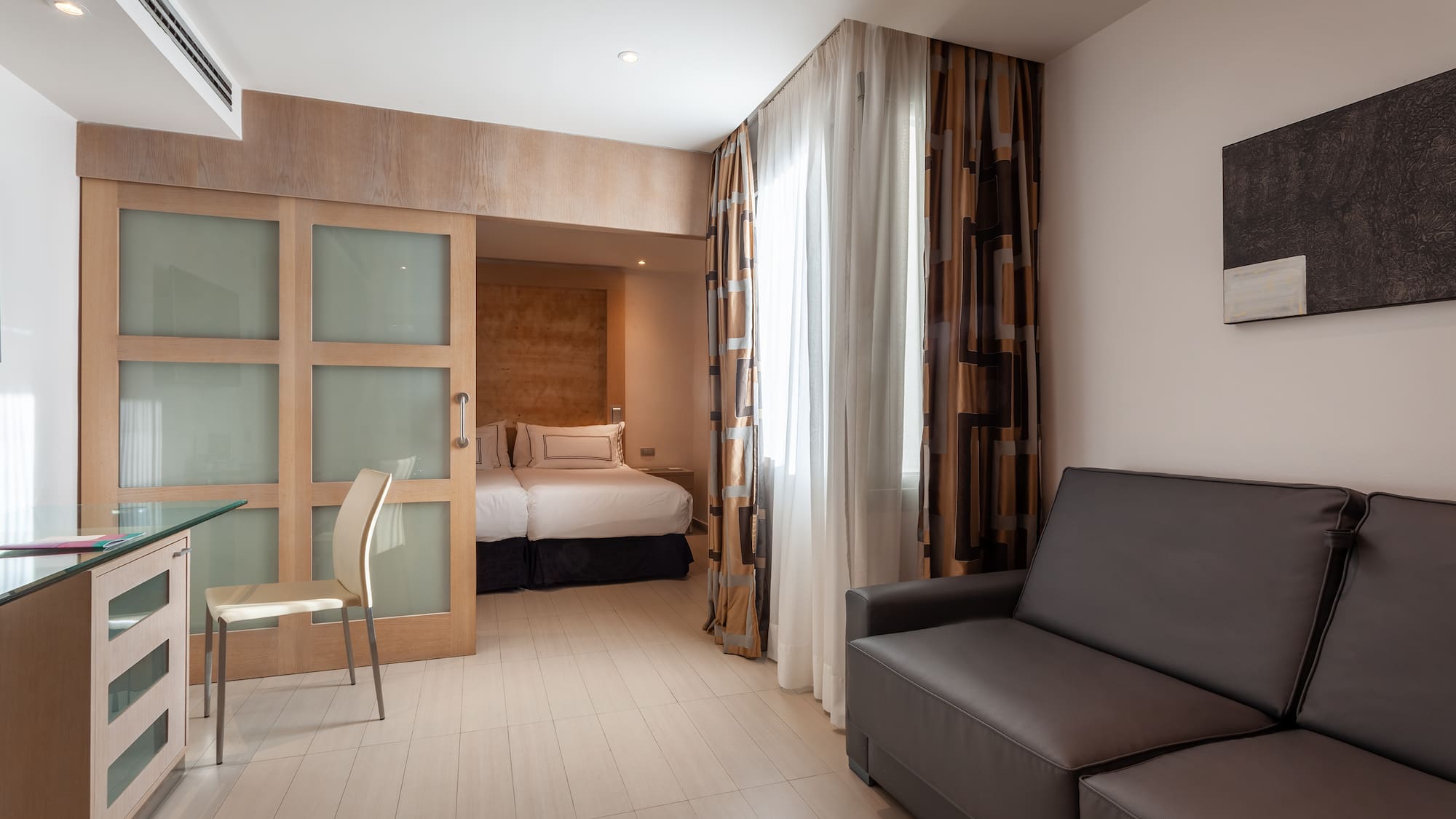 a room with a couch and a bed