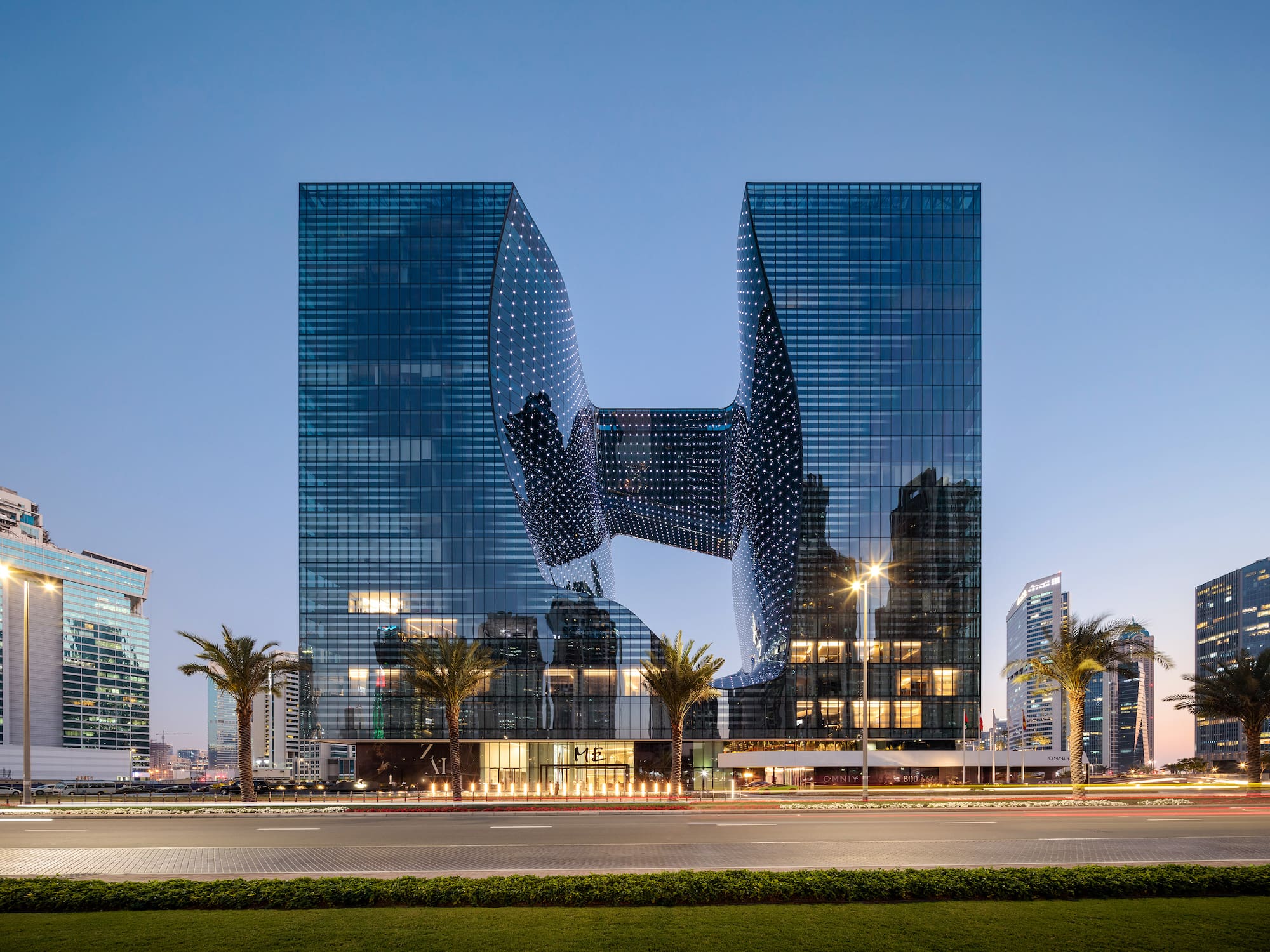 a building with a curved glass facade