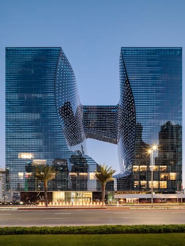 a building with a curved glass facade