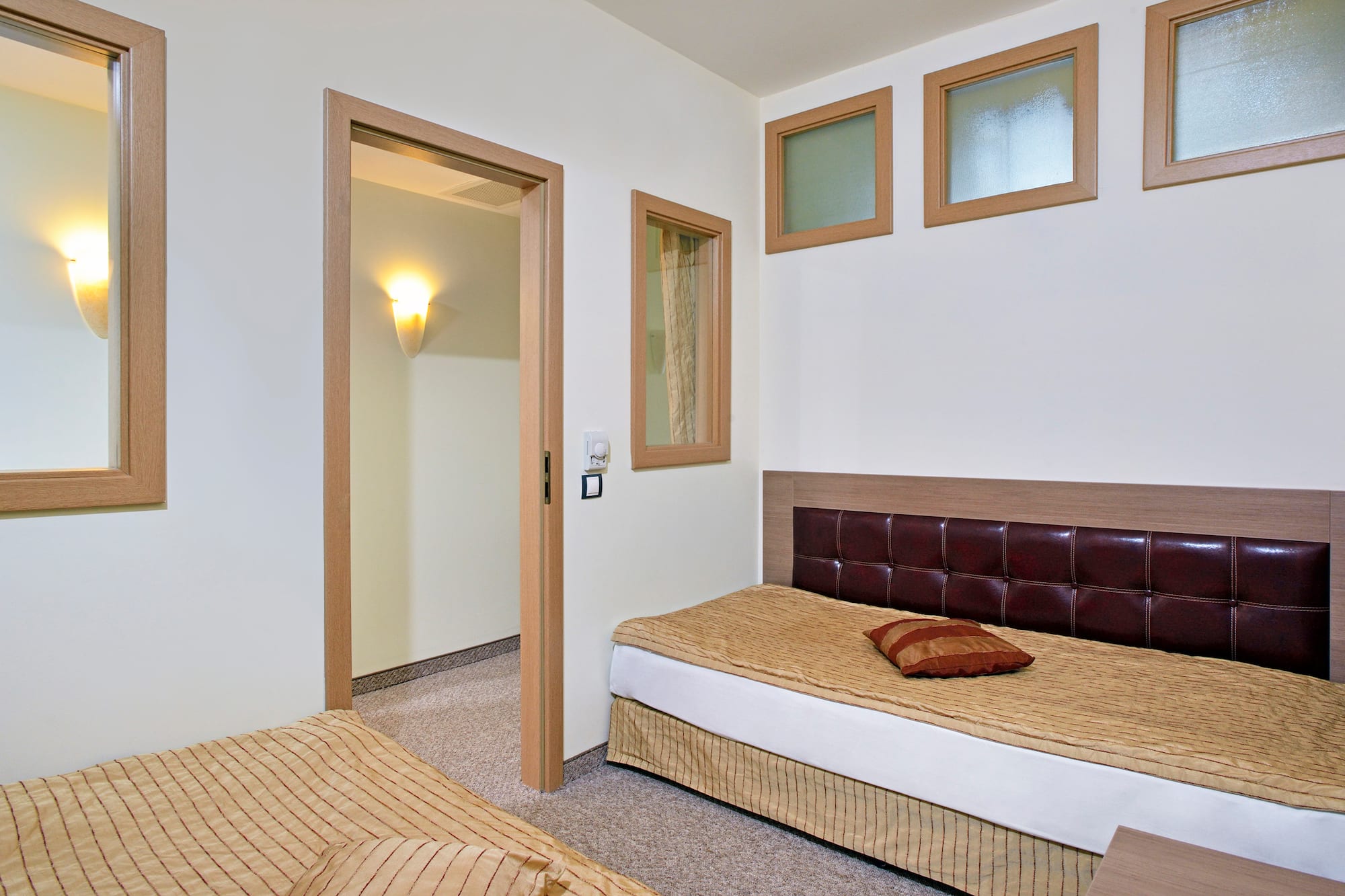 a bedroom with a bed and a door