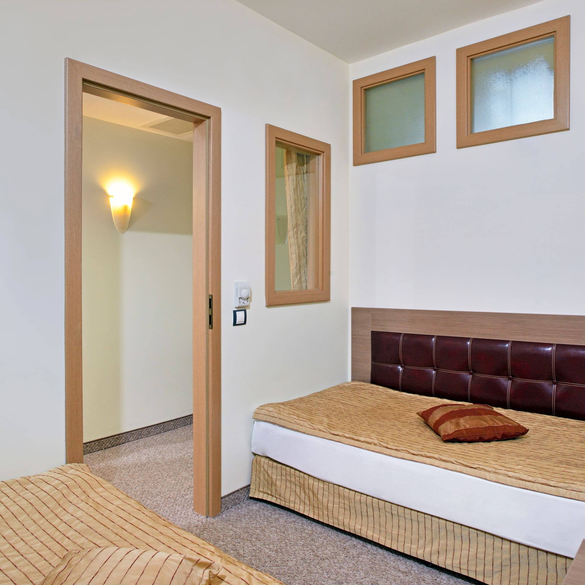 a bedroom with a bed and a door