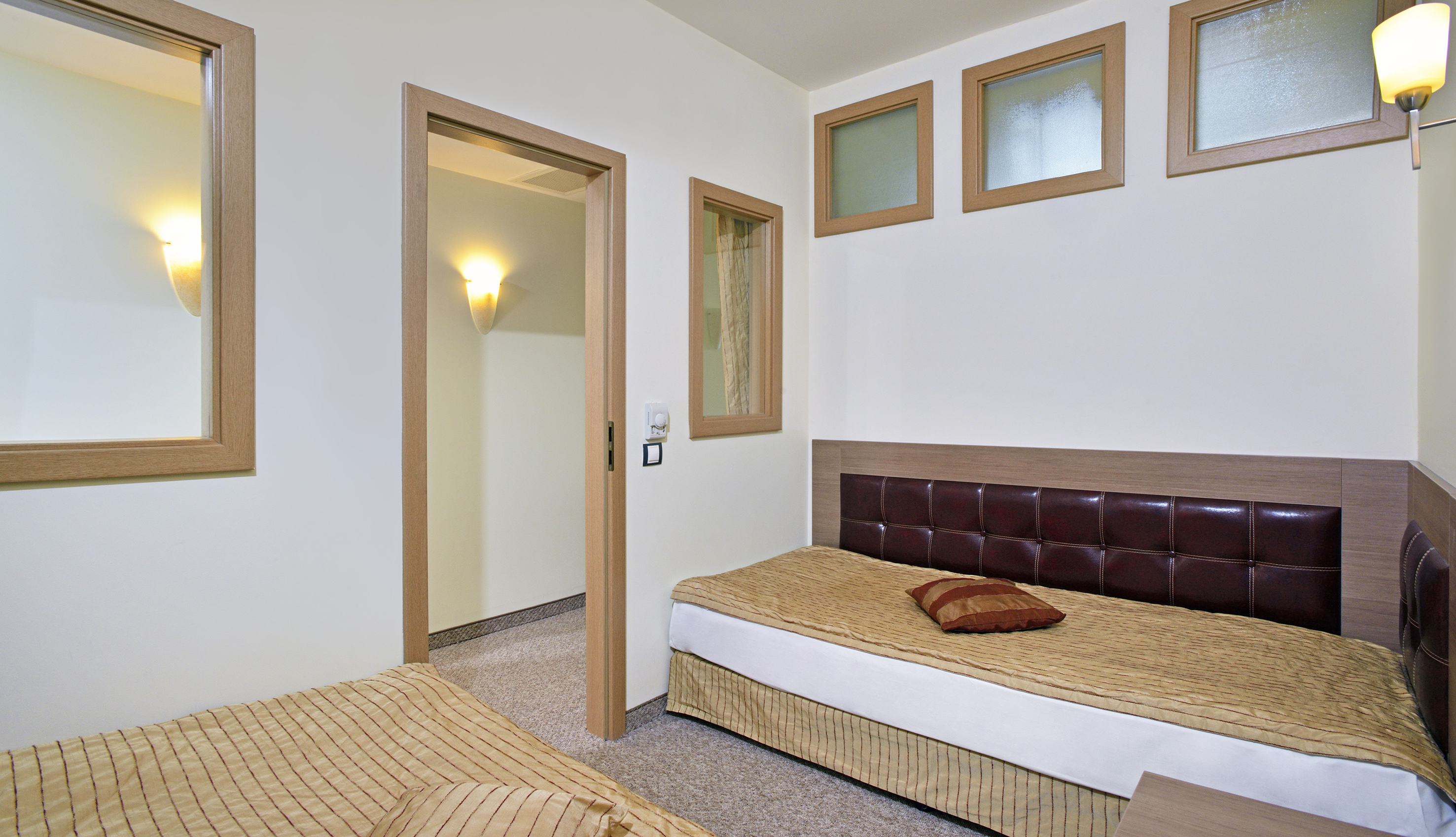 a bedroom with a bed and a door