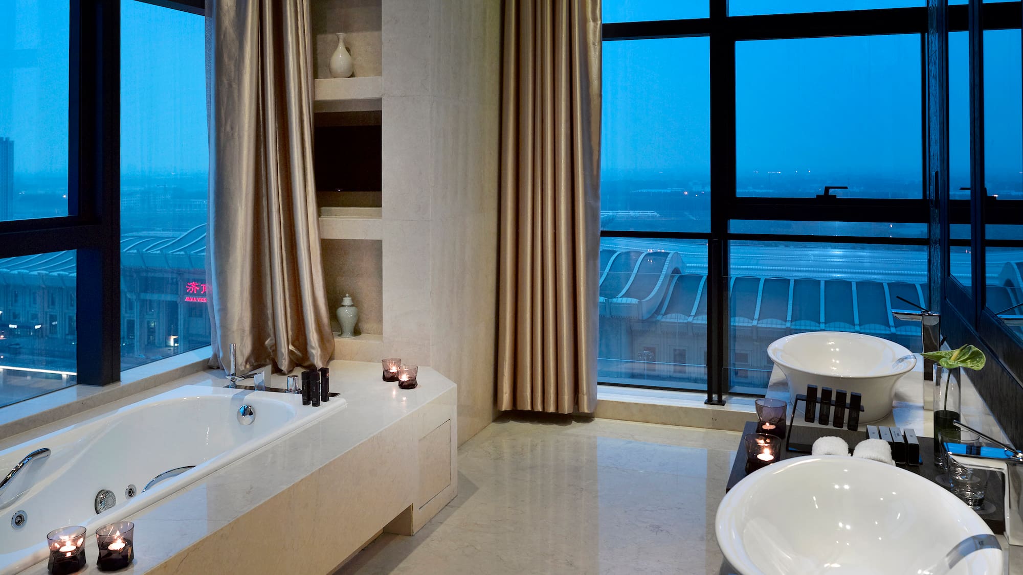 a bathroom with a bathtub and a tub