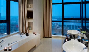 a bathroom with a bathtub and a tub