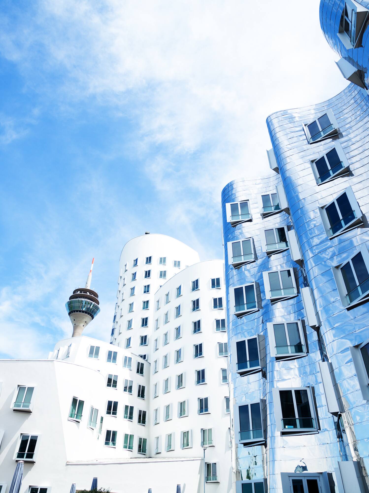 Düsseldorf modern architecture: wavy metallic buildings and Rheinturm.