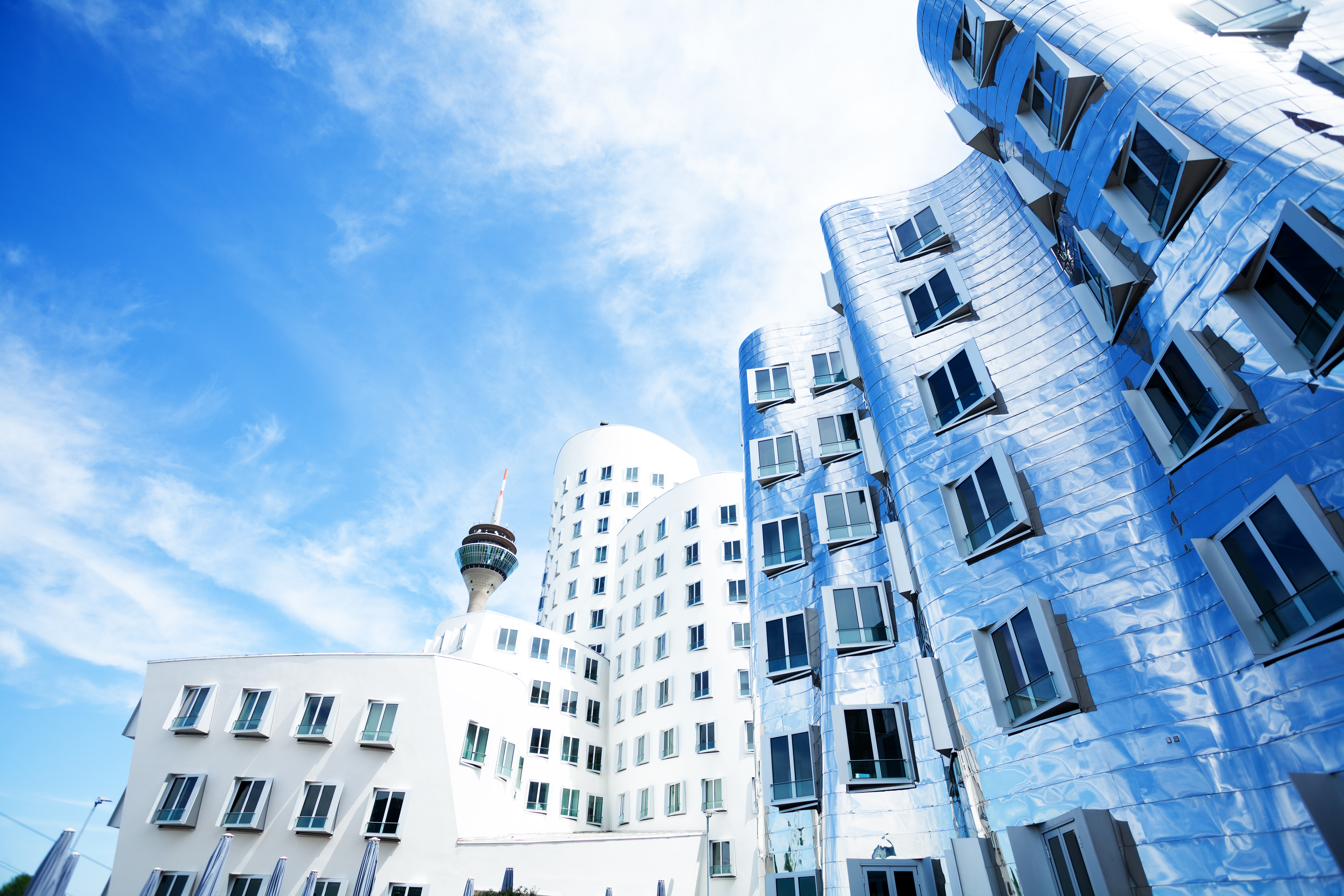 Düsseldorf modern architecture: wavy metallic buildings and Rheinturm.