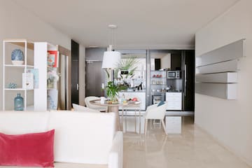 a living room with a table and chairs
