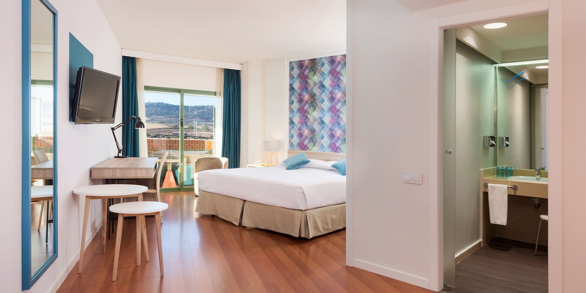 a room with a tv and a bed