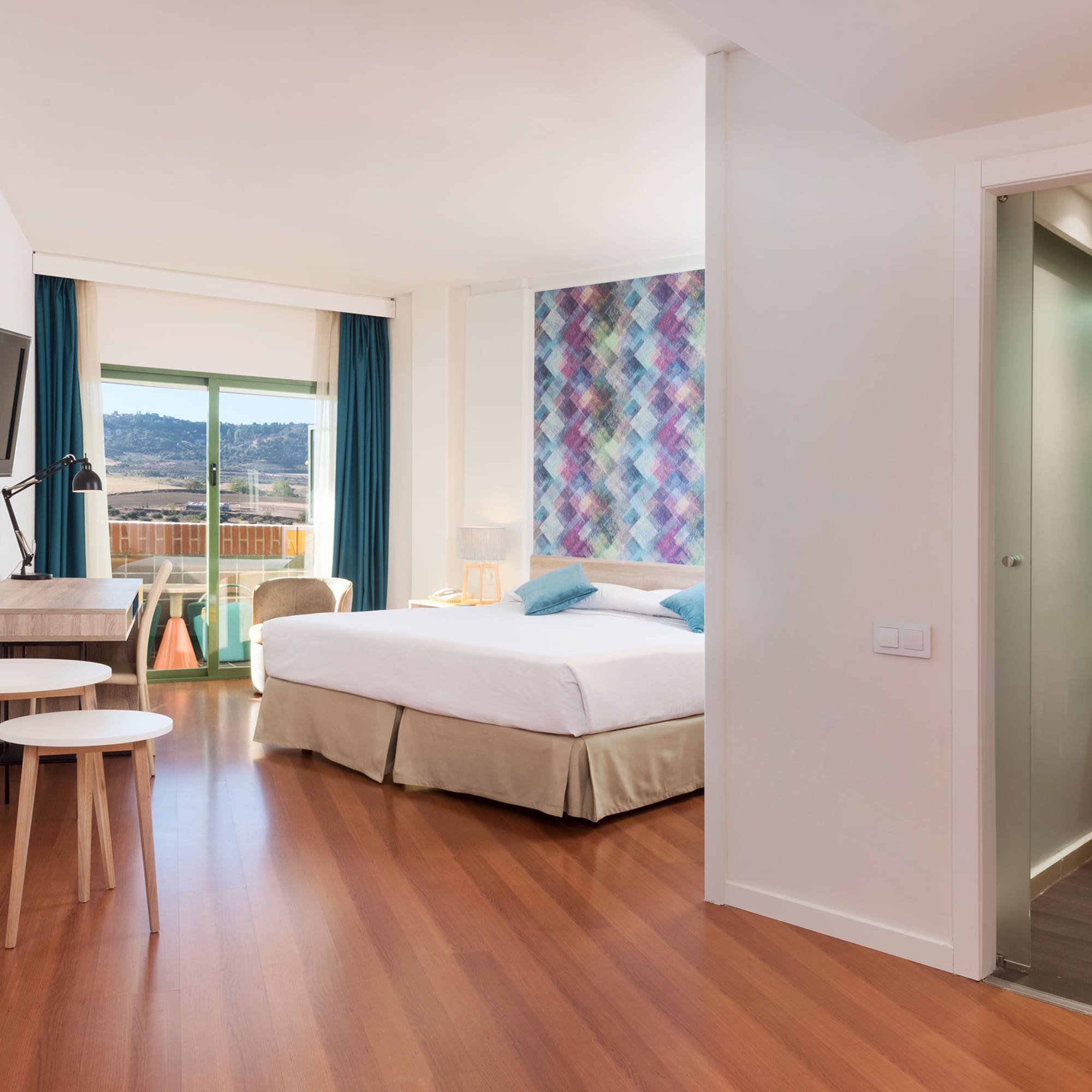 a room with a tv and a bed