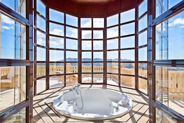 a large round tub with a window