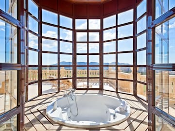 a large round tub with a window