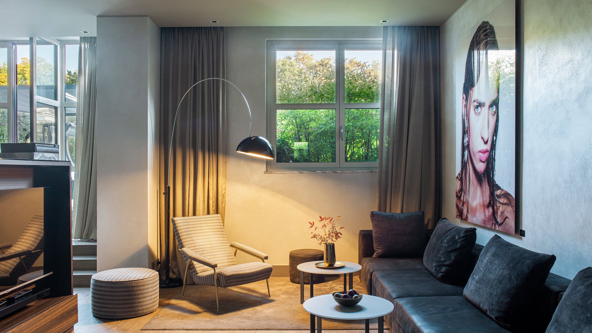 a living room with a couch and a lamp