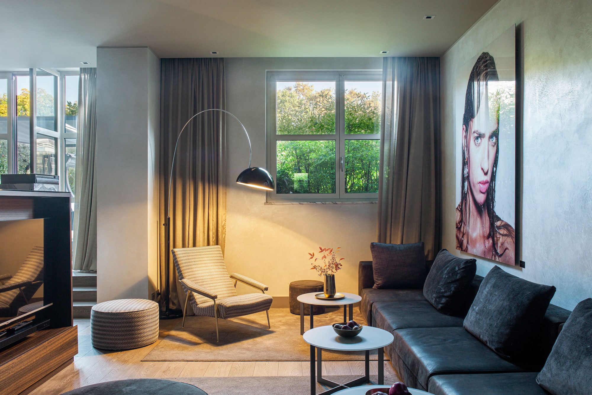 a living room with a couch and a lamp