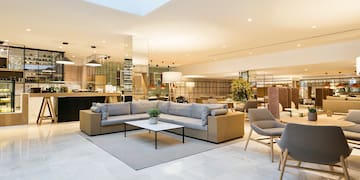 a large room with a couch and chairs