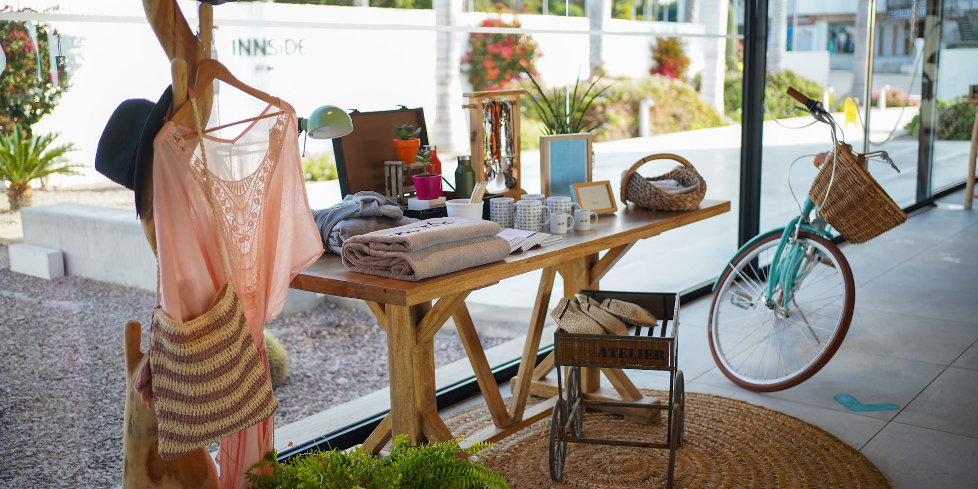 a table with items on it and a bicycle in the background