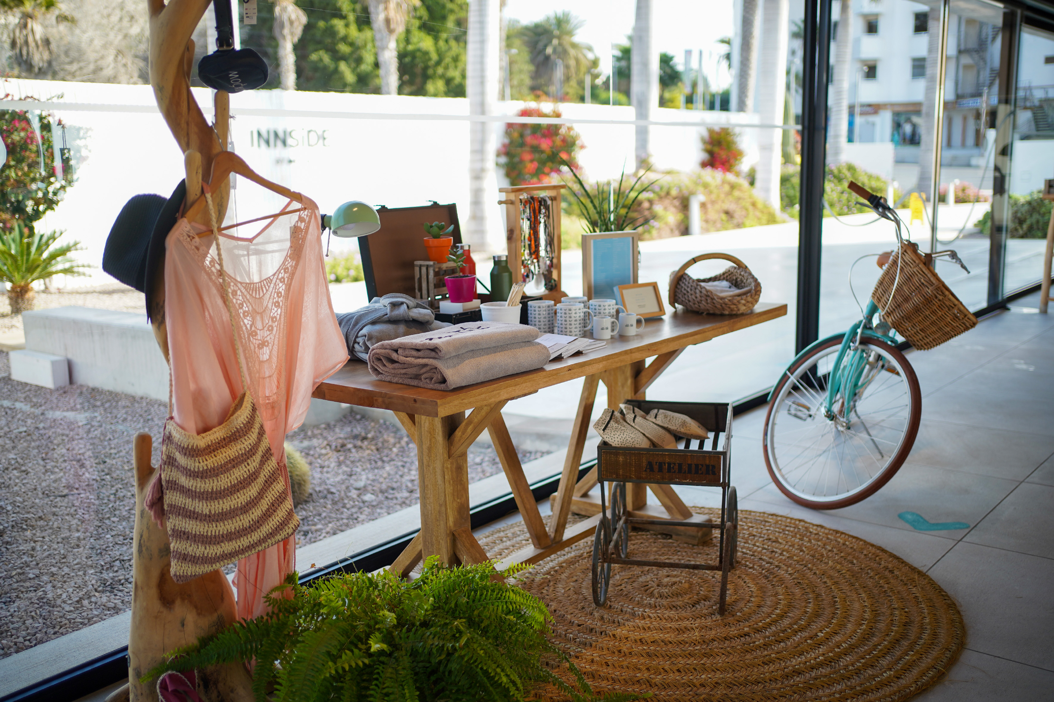 a table with items on it and a bicycle in the background