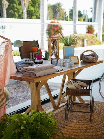 a table with items on it and a bicycle in the background