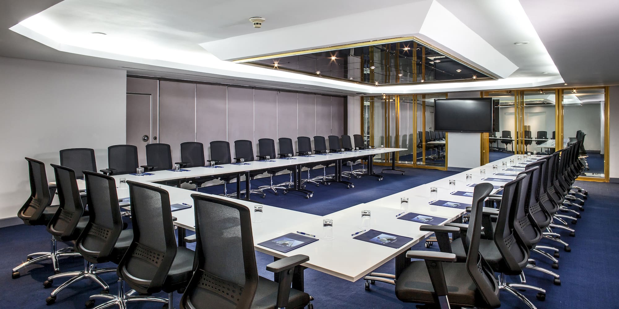 a conference room with a large table and chairs