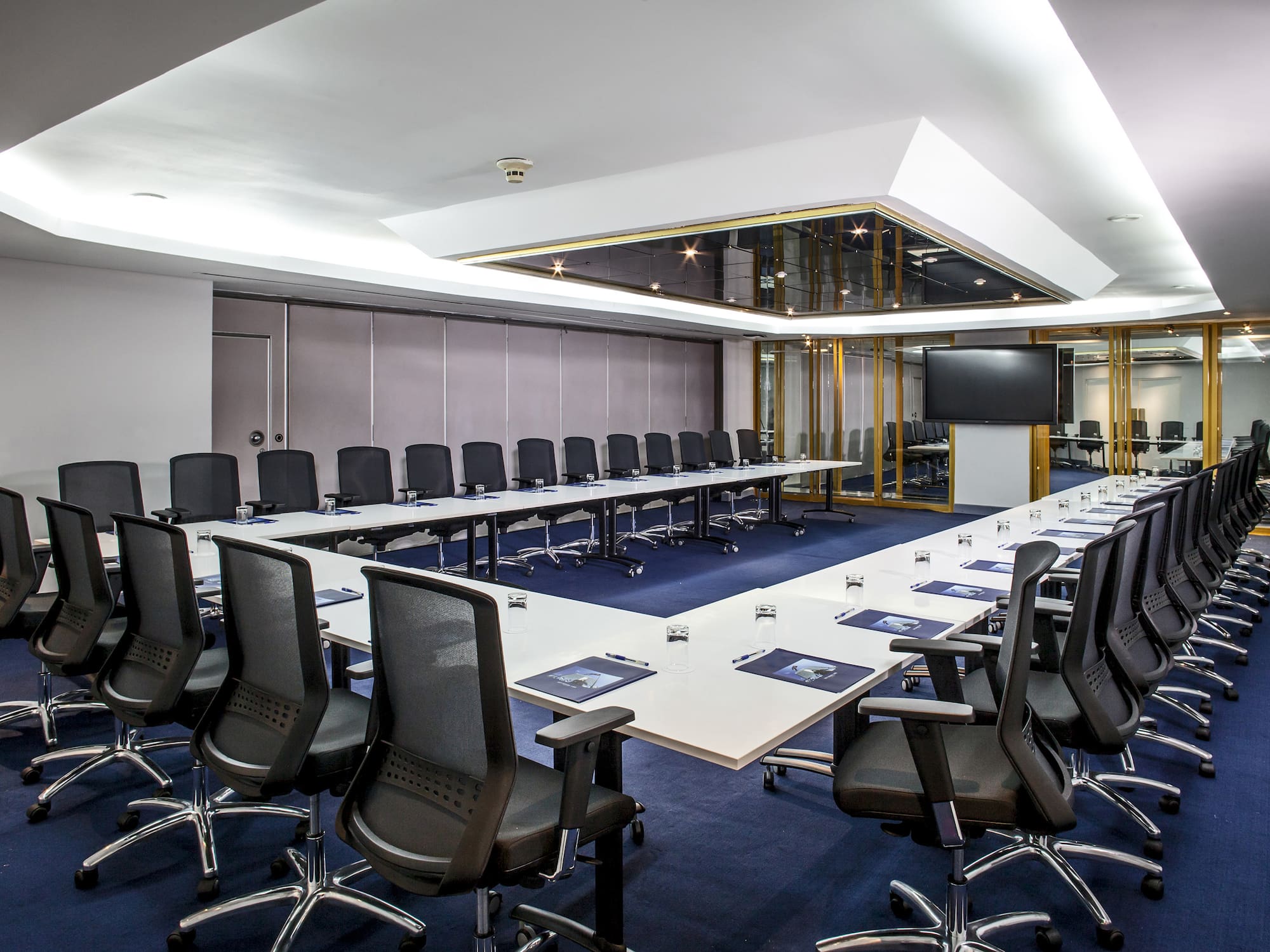 a conference room with a large table and chairs