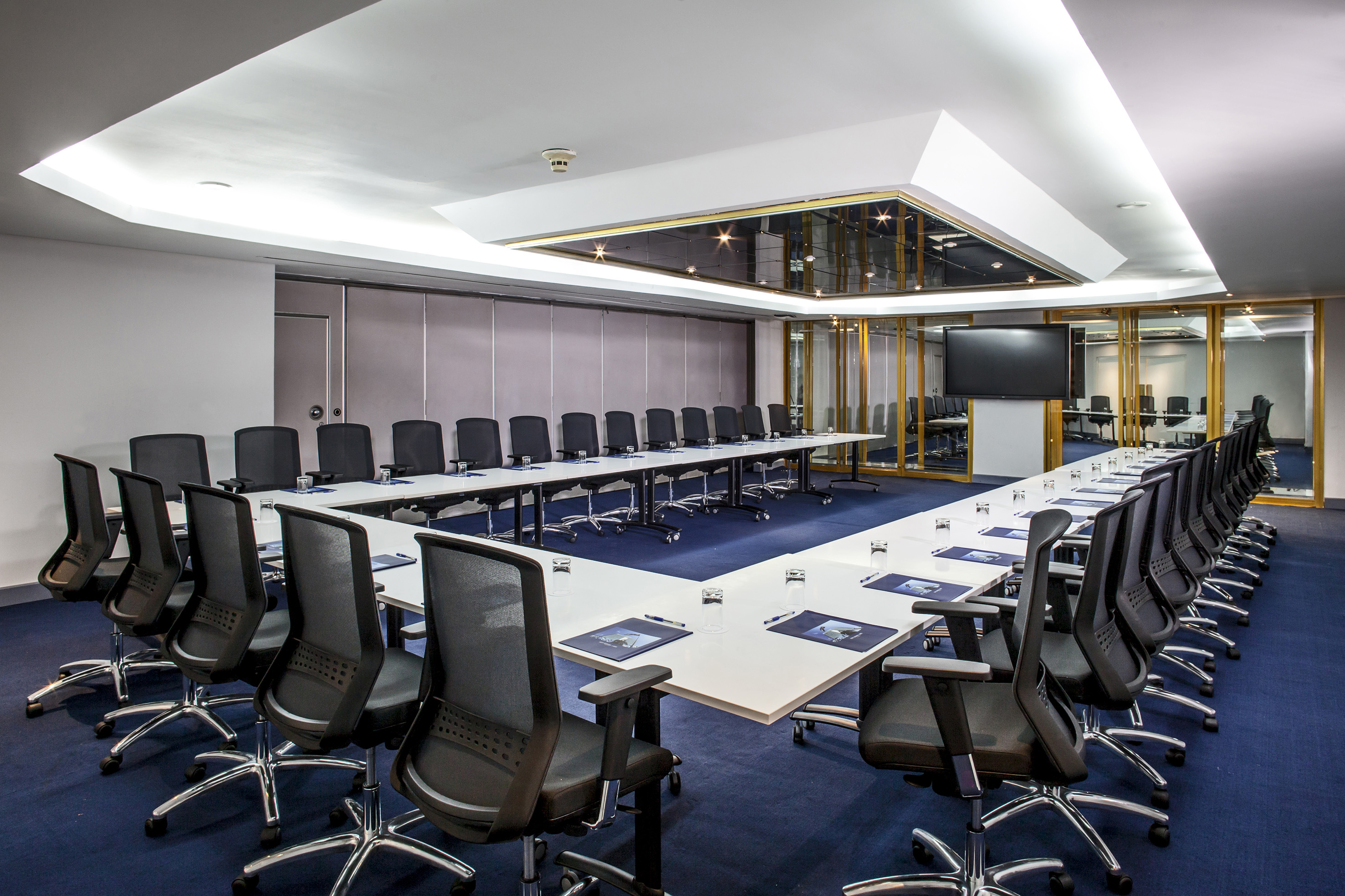 a conference room with a large table and chairs