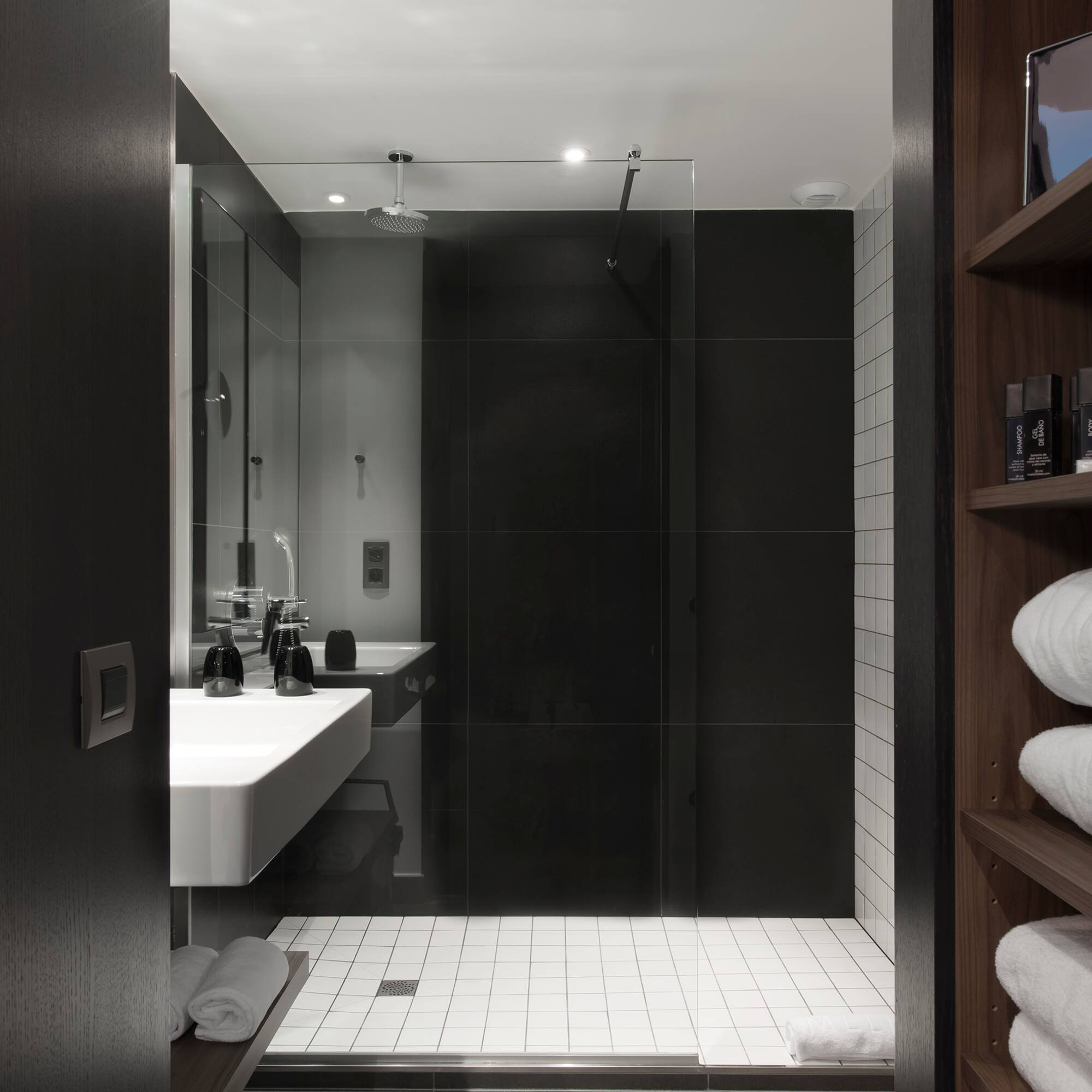a bathroom with a glass shower door