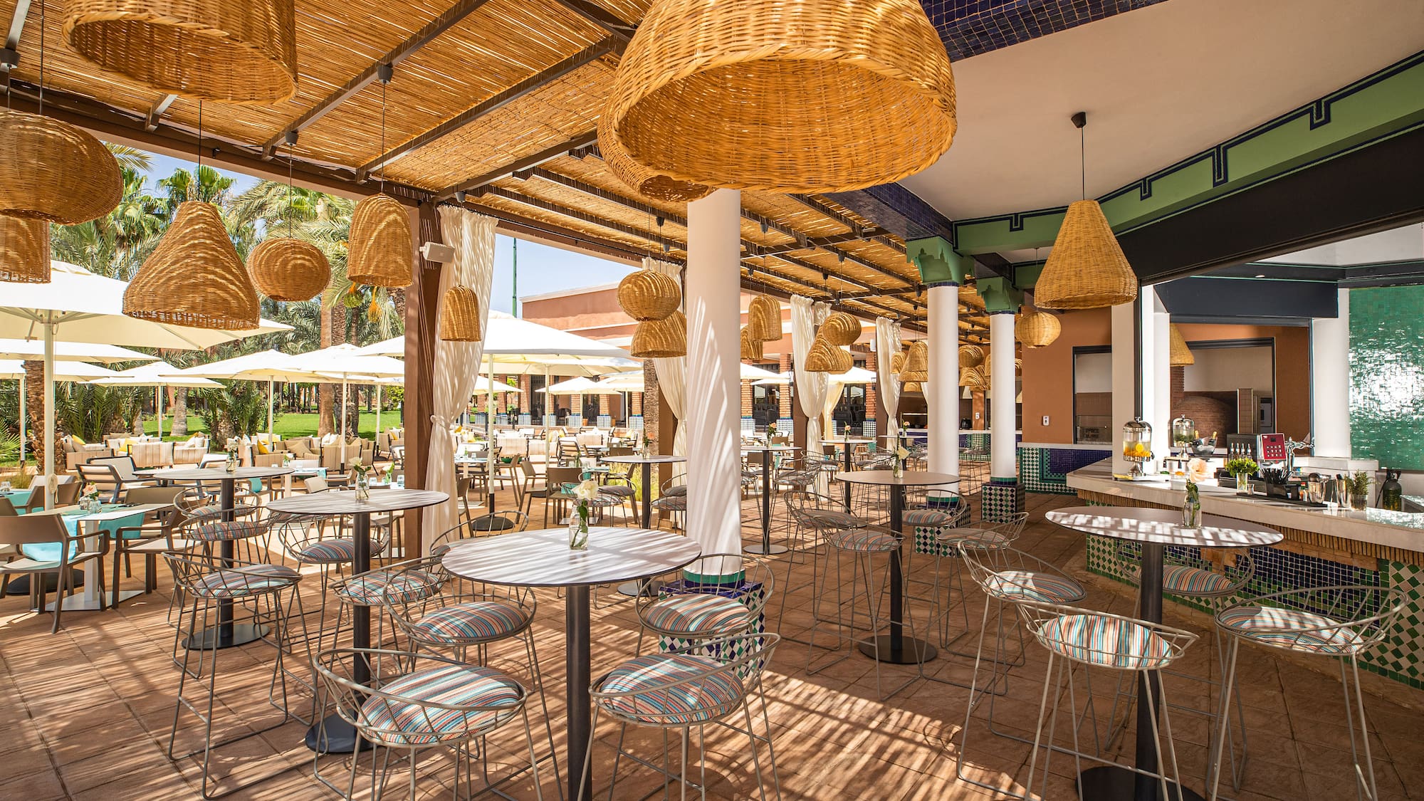 a patio with tables and chairs