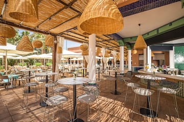 a patio with tables and chairs