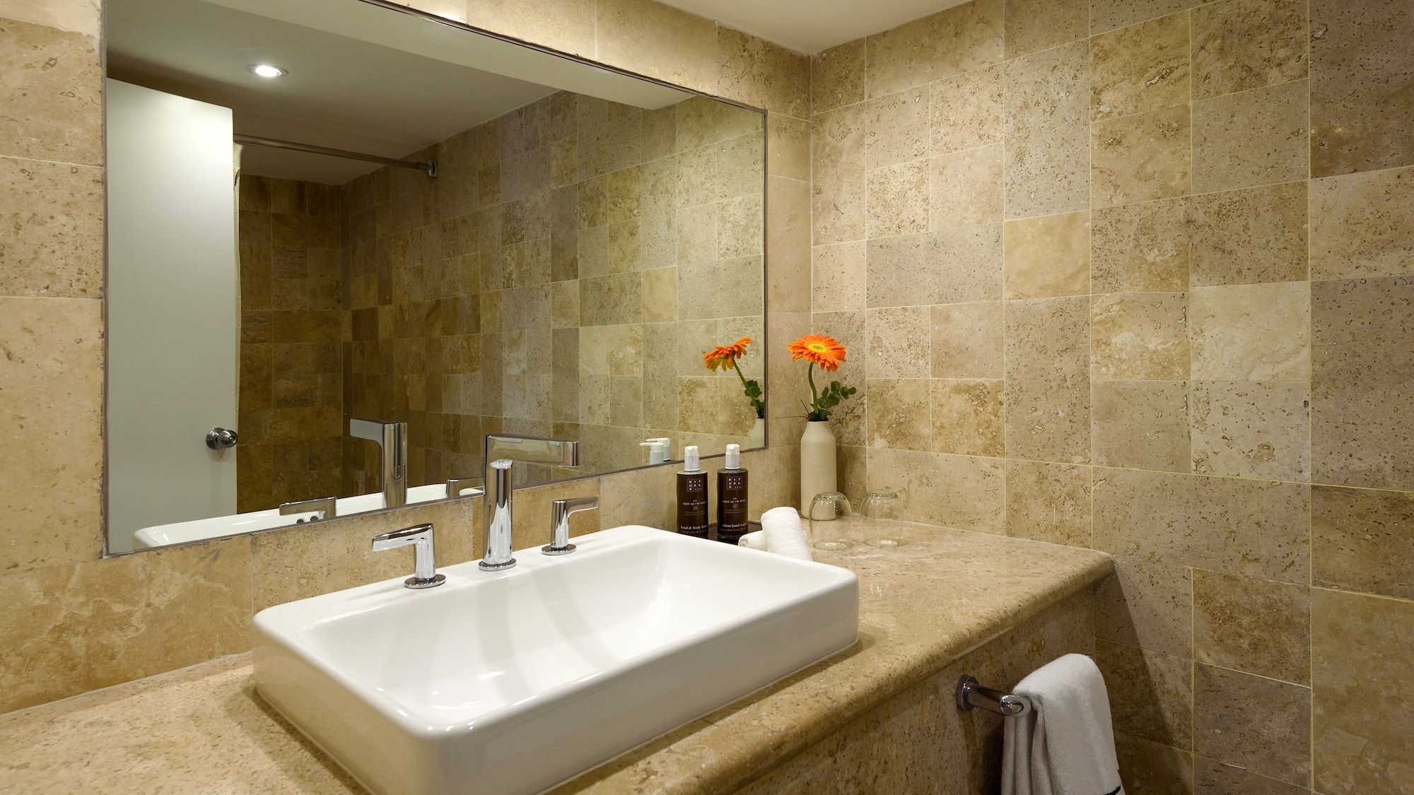 a bathroom with a sink and mirror
