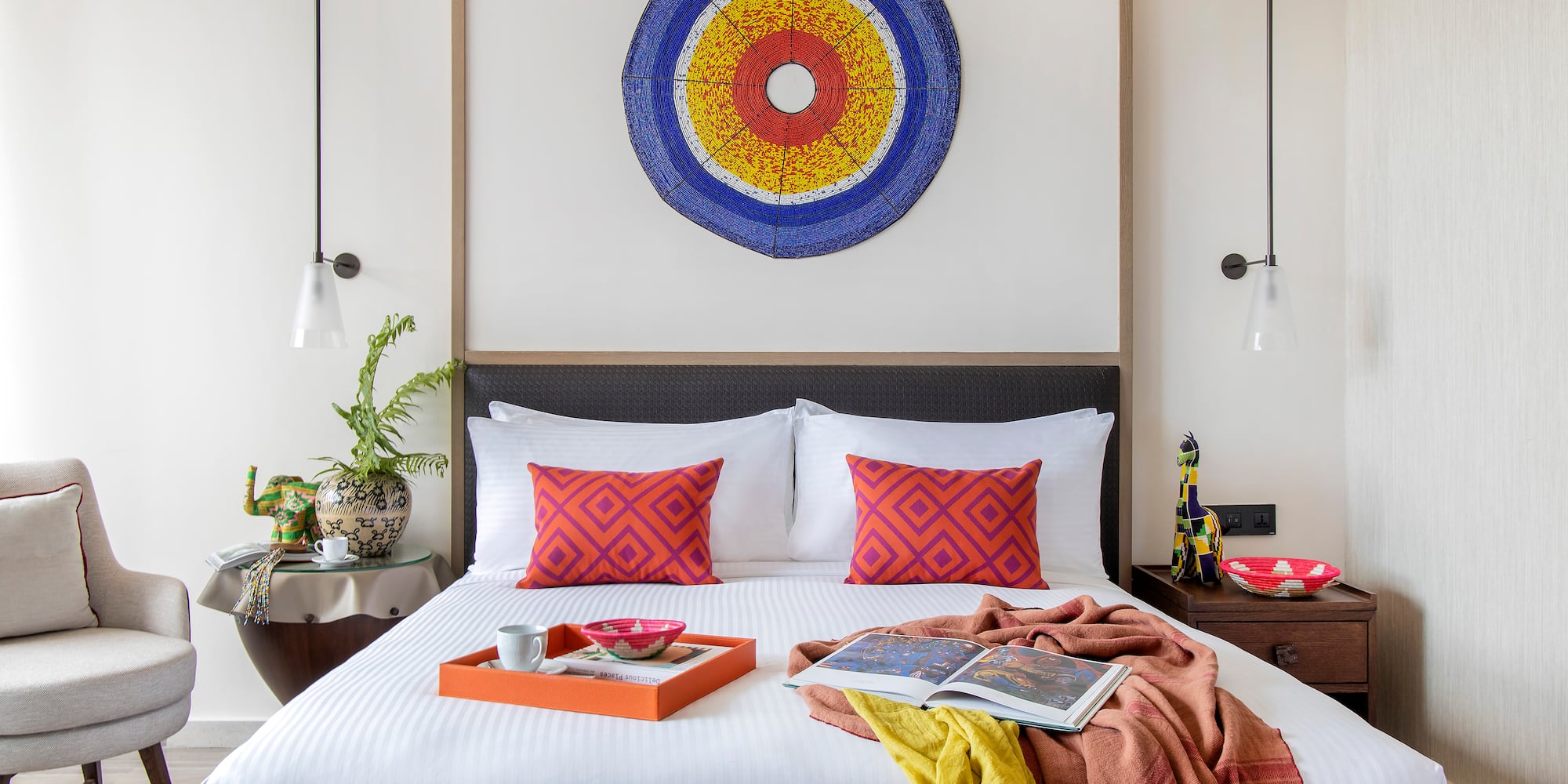 a bed with a tray of food on it