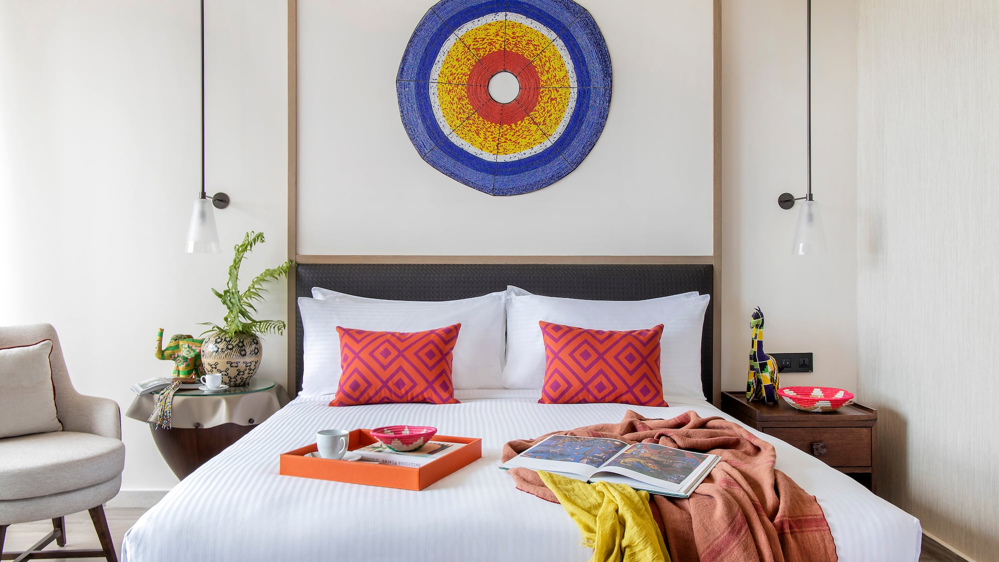 a bed with a tray of food on it