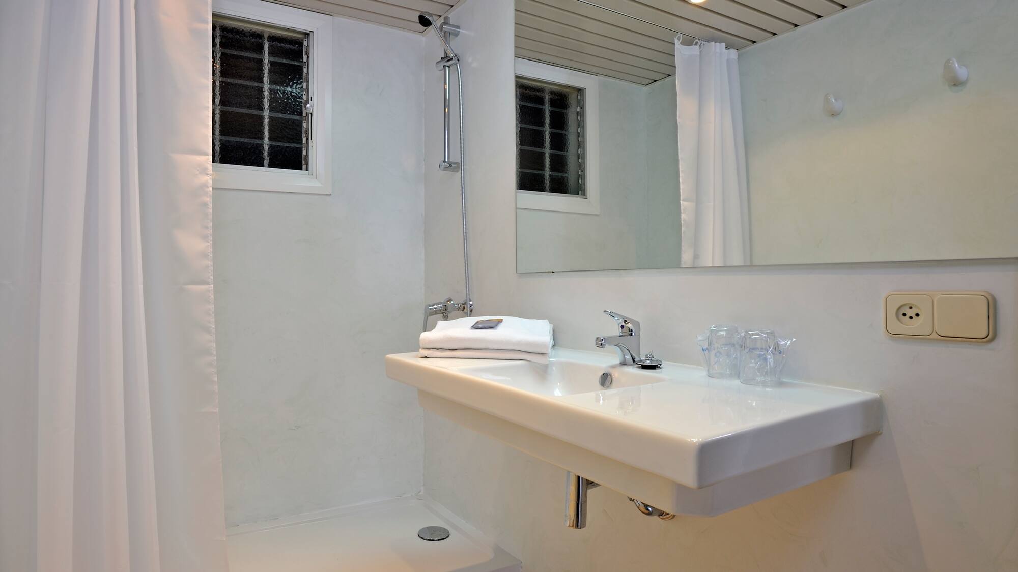 a bathroom with a sink and shower