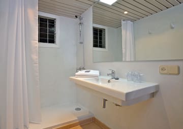 a bathroom with a sink and shower