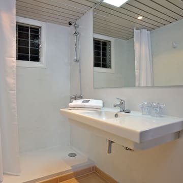 a bathroom with a sink and shower