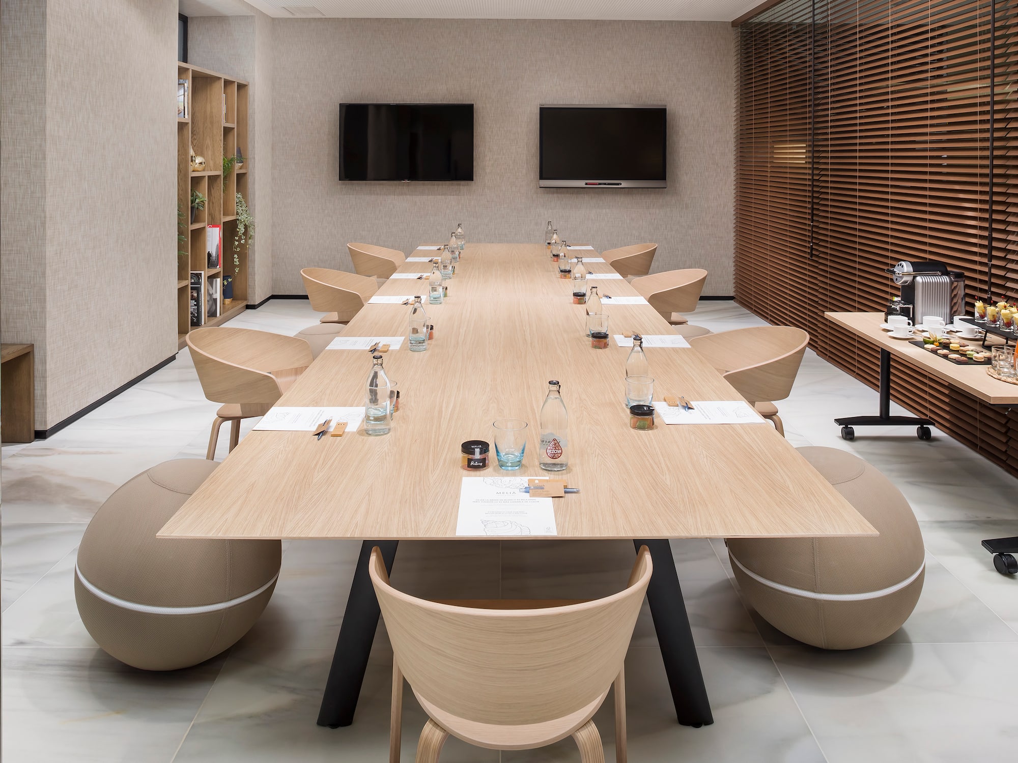 a conference room with a table and chairs
