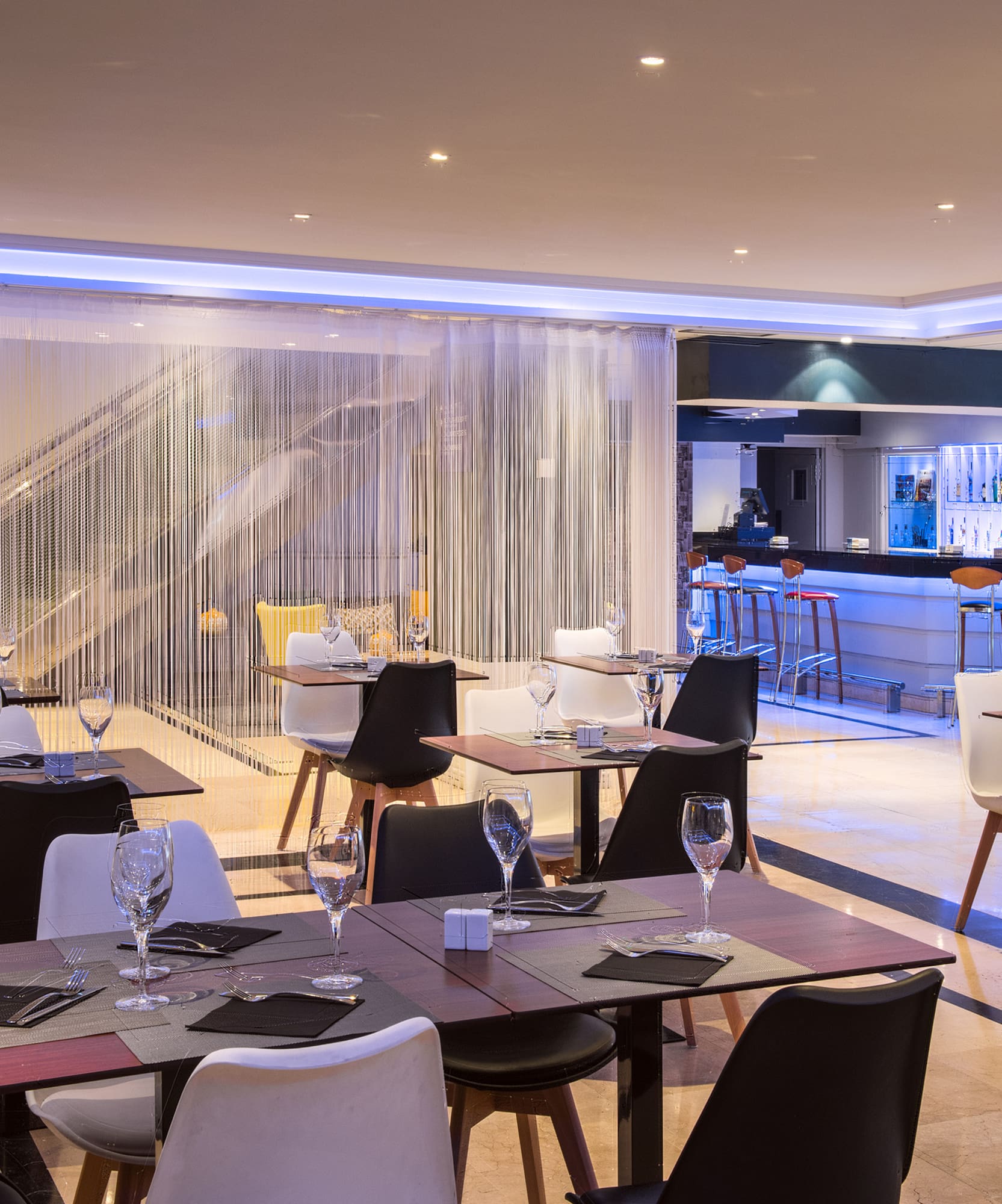 a restaurant with tables and chairs