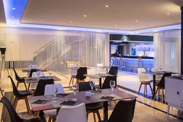 a restaurant with tables and chairs