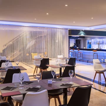 a restaurant with tables and chairs
