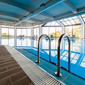 a swimming pool with a large window