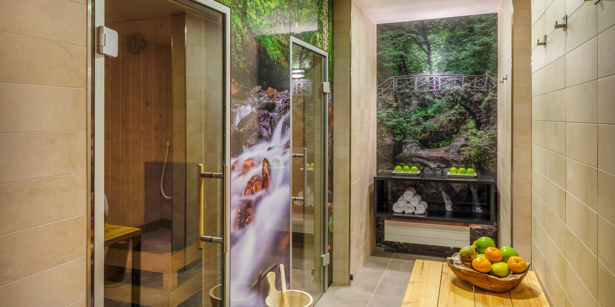 a room with a glass shower and a wooden bench