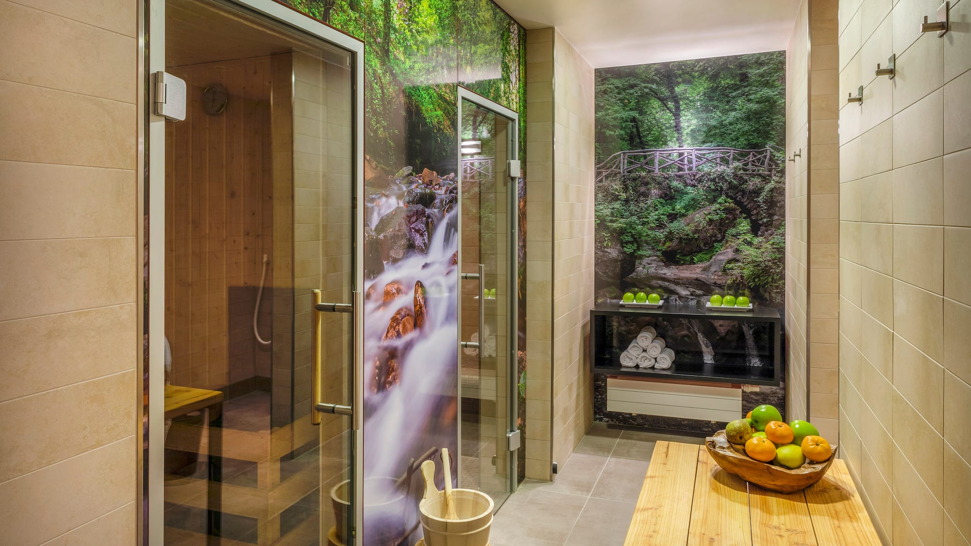 a room with a glass shower and a wooden bench